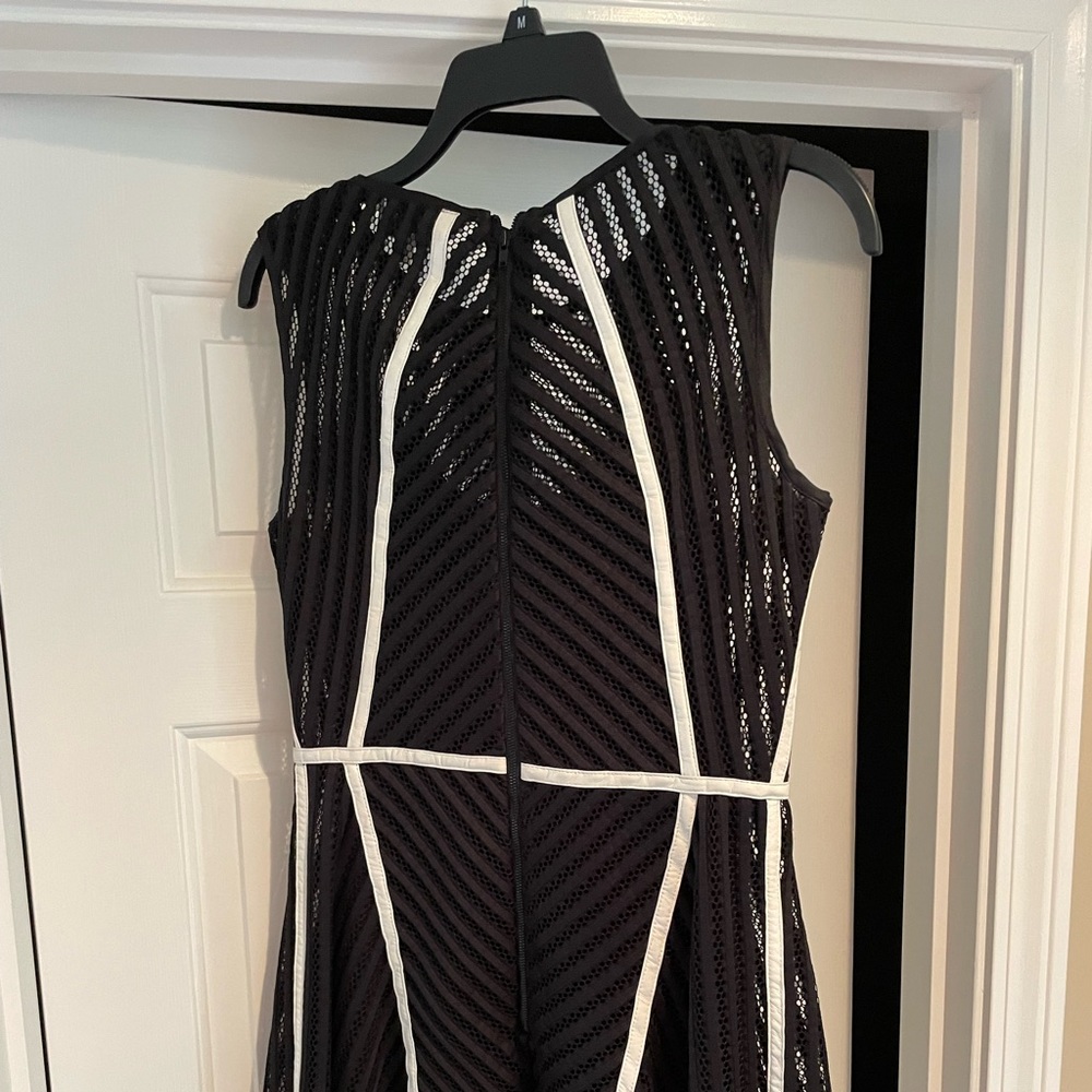 Mini dress, detail pattern and texture. Black with white detail.